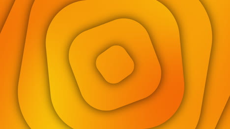 rotation of yellow rounded square shapes with shadows. geometric looped background.