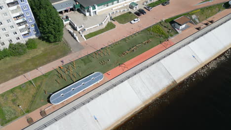 aerial view of urban waterfront park and embankment