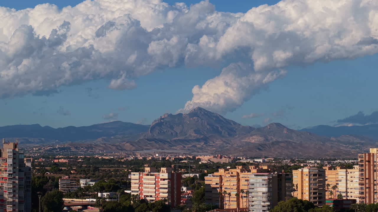 Cityscape with Mountain and Clouds