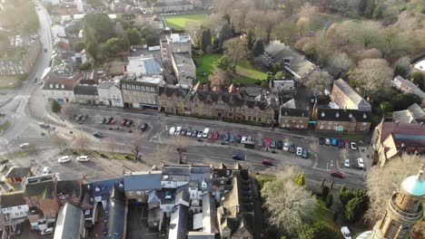 Drone-footage-of-a-busy-road-next-to-the-Whately-Hall-Hotel-in-Banbury,-Oxfordshire,-UK