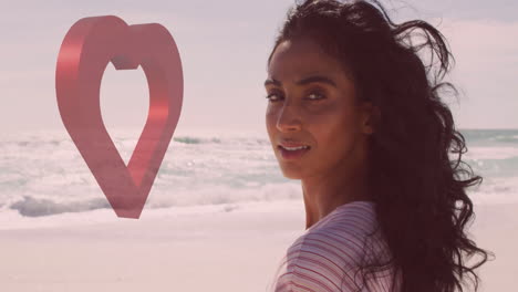 woman with flowing hair standing on beach with heart-shaped animation