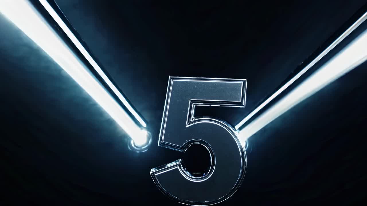 Futuristic video concept with a metallic number 5, illuminated by diagonal light beams
