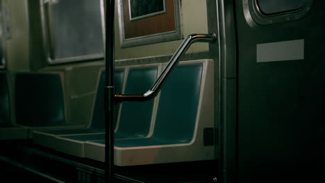 empty subway car with green seats and door