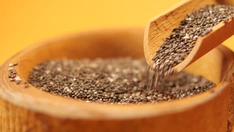 close up of chia seeds in a wooden bowl