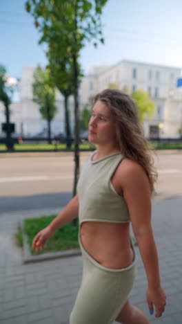 woman walking down a city street