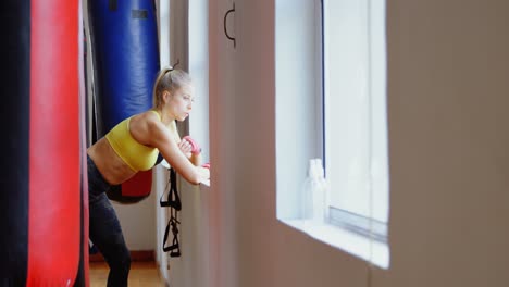 Male-boxer-standing-in-fitness-studio-4k