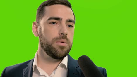 a stylish, positive young man gives an interview. close-up. chromakey.