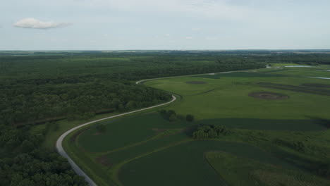 aerial view of four rivers wildlife conservation area with green trees, river and wetland in missouri, usa