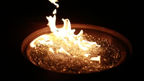 a fire burns at night in 120p super slow motion