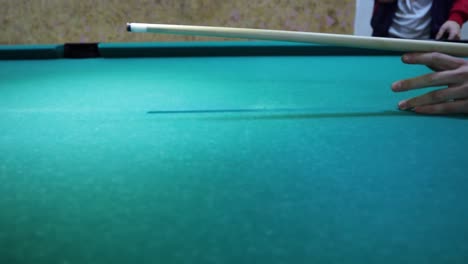 pool stick hiting the ball