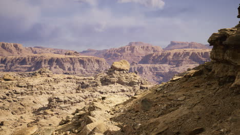 majestic rock formations in a desert landscape under a cloudy sky