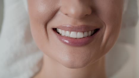 close up video of woman showing full smile.