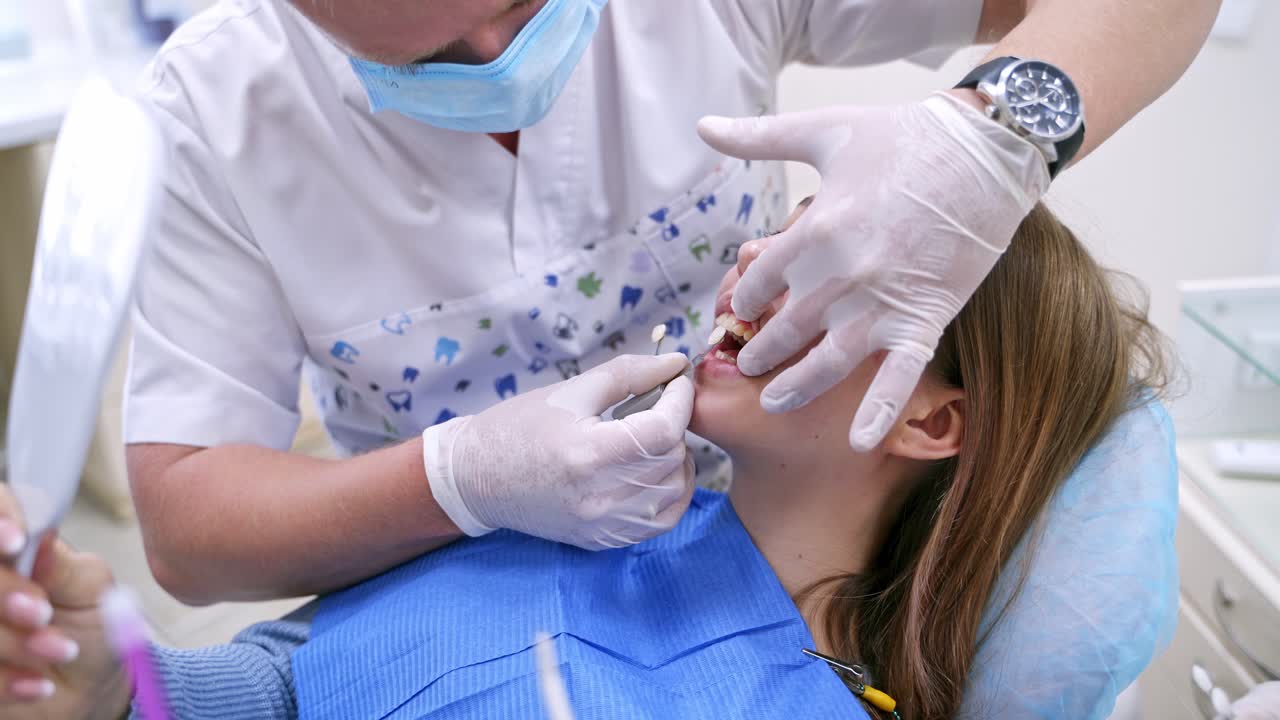 Portrait of patient in dental chair. Patient woman visit dentist in stomatology clinic