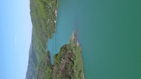 scenic flyover above lake formed by maneciu dam in romania