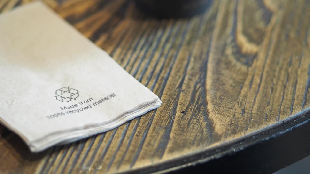 Napkin made from recycled material on wood table
