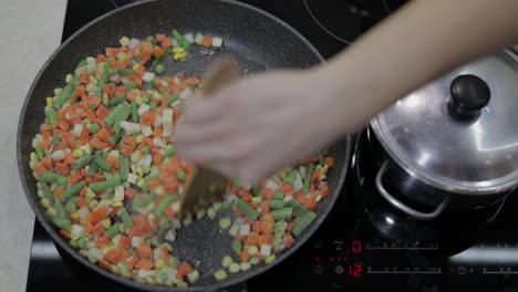 pan fry meal of delicious asparagus, pepper, corn and carrot. vegetarian meal