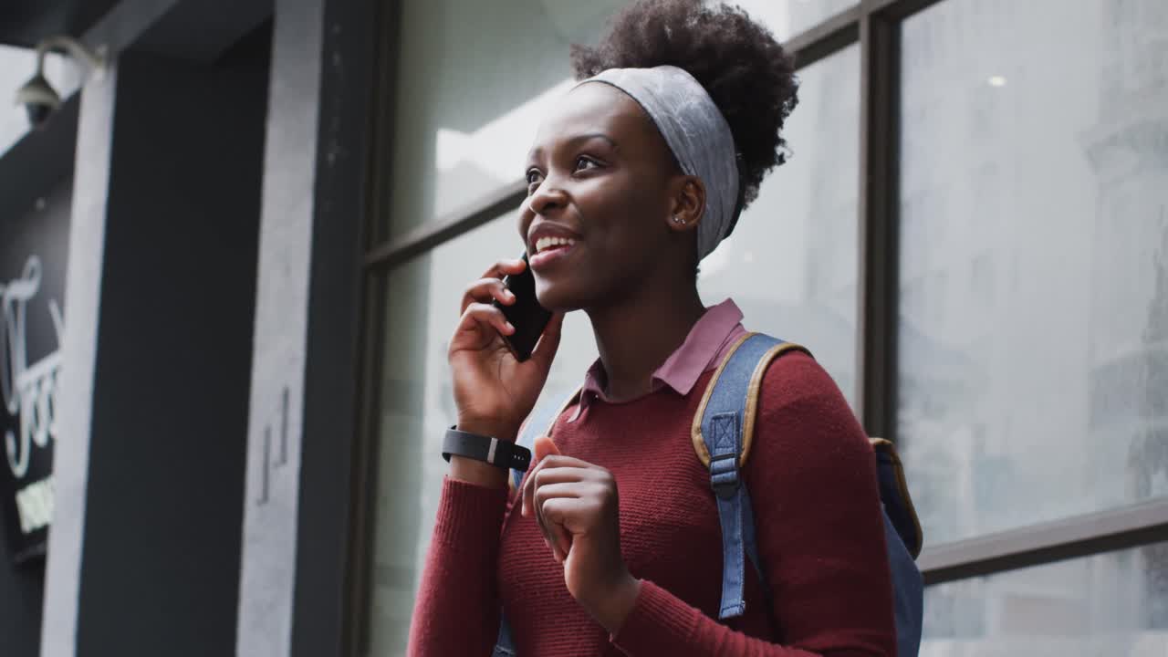 African american talking on her smartphone in street