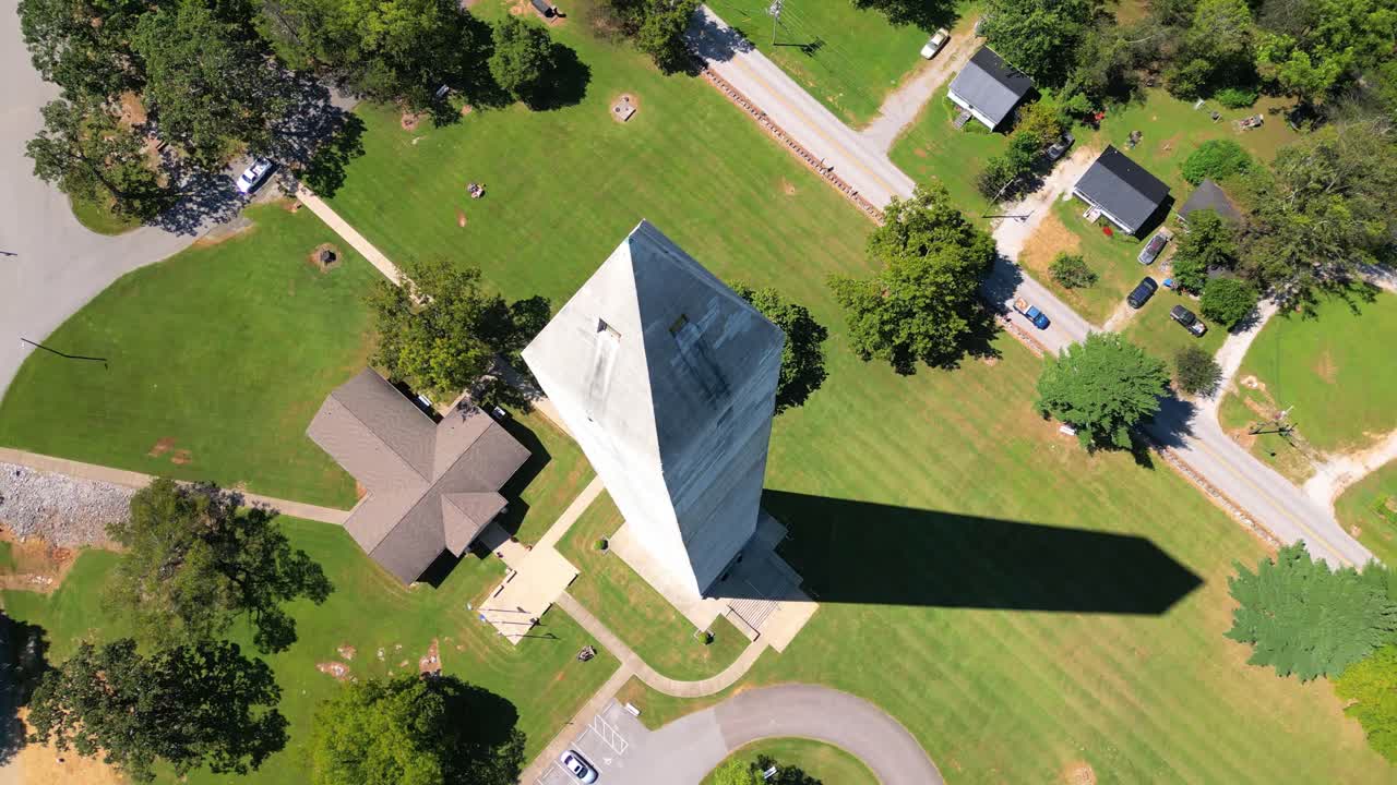 Aerial overhead orbit of the Jefferson Davis Monument located in Fairview, Kentucky