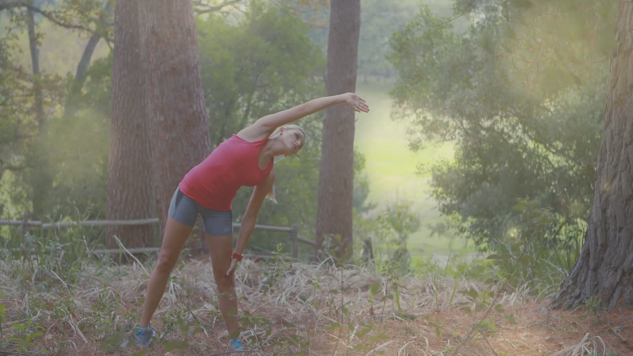 Woman tapping health tracker initiating side stretching in sunlit forest with arrows showing form