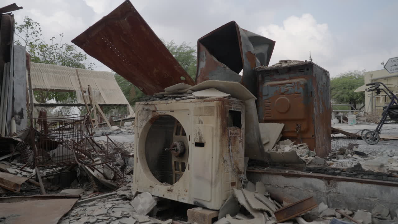 Destroyed burned down home in Kibbutz Nir Oz, remains in ashes, slow motion