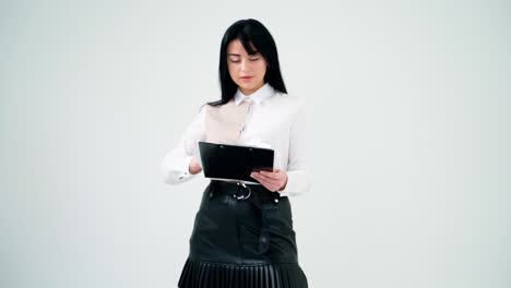 pretty woman and a businessman on white background. portrait of a beautiful business woman with a folder. handsome man working on a tablet.