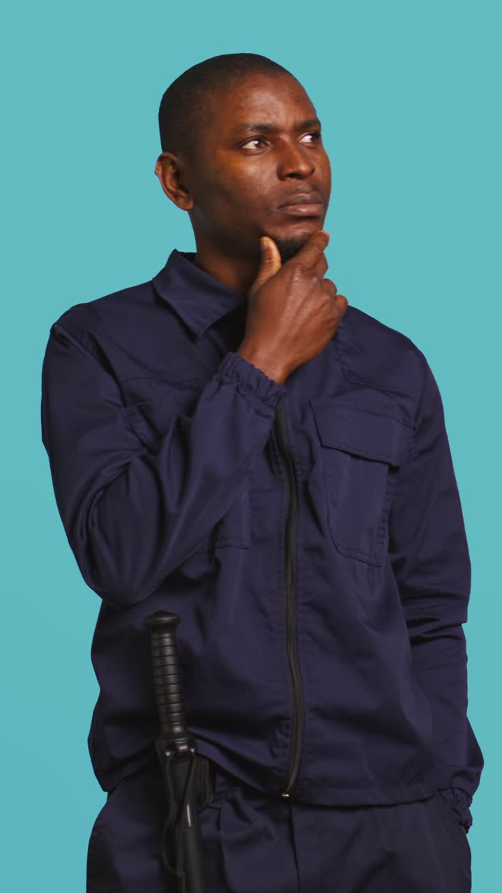 Thoughtful African American Security Guard Pondering