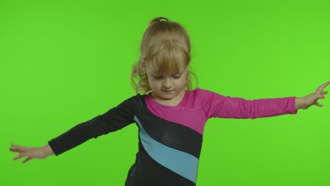 Child-ballerina-exercising-in-studio-on-chroma-key-background.-Girl-kid-dancing,-making-gymnastics