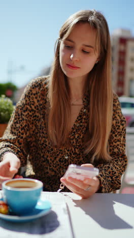 young woman in outdoor cafe