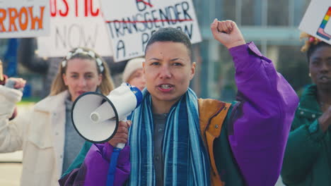 Group-Of-Protestors-With-Placards-And-Megaphone-On-Demonstration-March-For-Gender-Equality