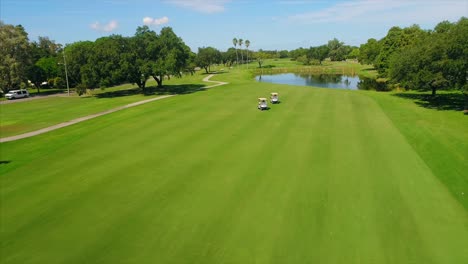 aerial fly over of golf course green in st