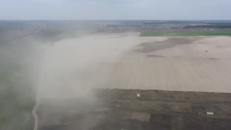 dust storm in the field. demolishes the fertile layer of black soil and crops.