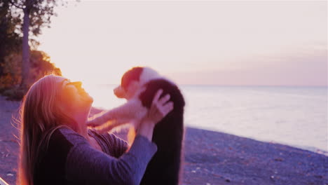 a young woman plays with a dog 3