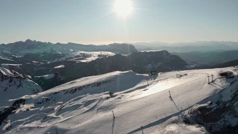 Dolly-forward-drone-shot-over-high-alpine-ski-slope