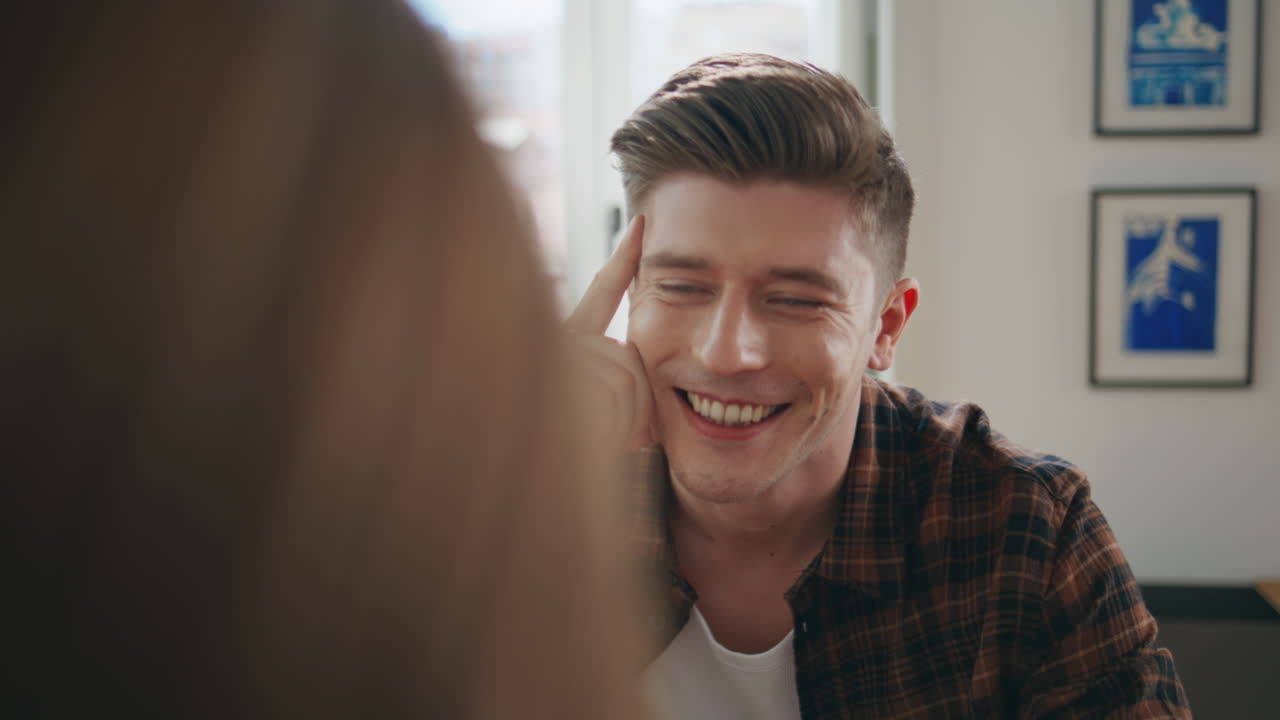Handsome guy talking date closeup. Relaxed man enjoying pleasant conversation