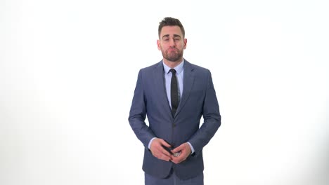 Young-Guy-arranging-his-suit-before-showing-Cryptocurrencies-while-smiling-and-making-faces