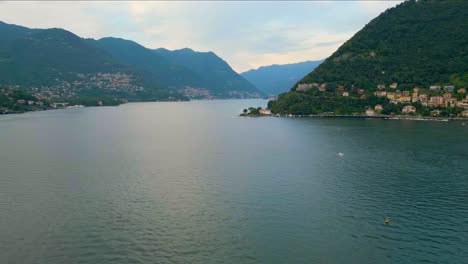 4k aerial drone video of boats in the marina on beautiful lake como, italy in the summer