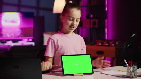 child media star showing isolated screen tablet to fans, unpacking it and presenting specifications