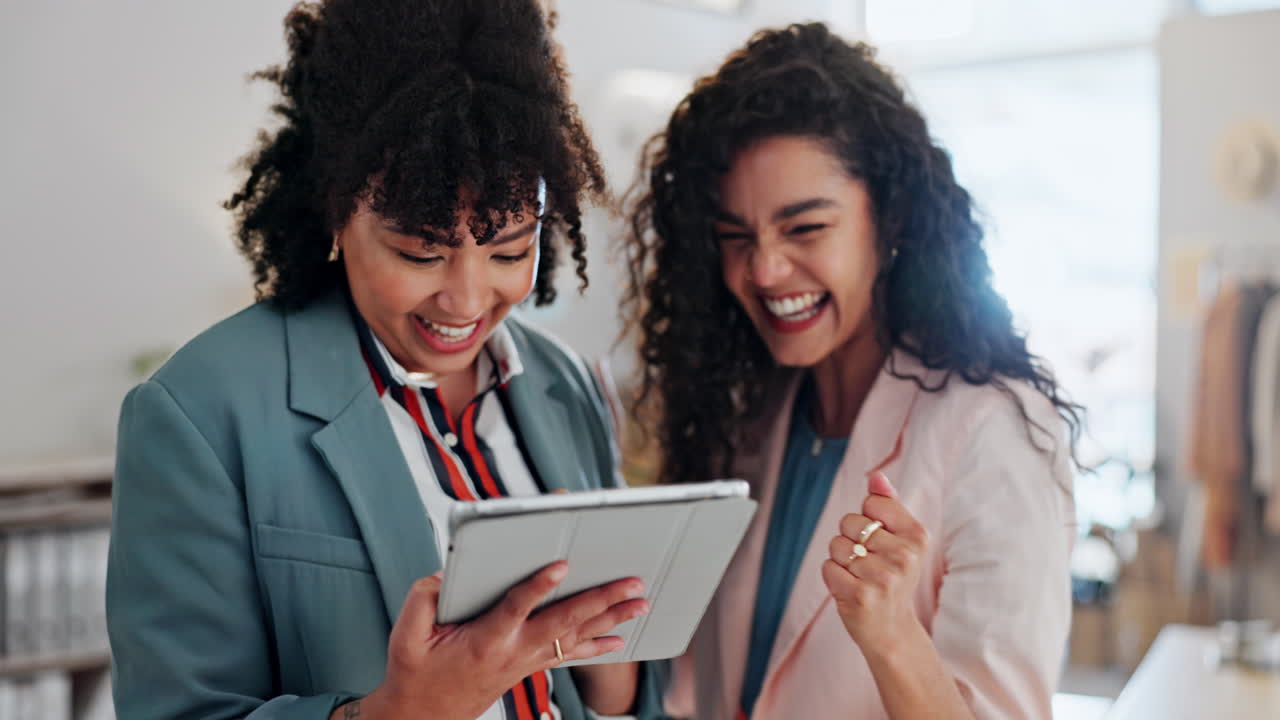 Designer women, high five and tablet for teamwork
