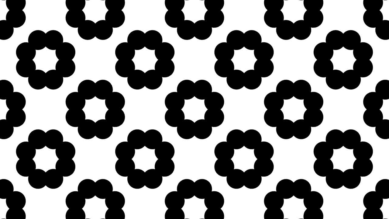 검은색과 색의 그래픽 패턴은 스트로보스코픽과 최면 효과를 가지고 있으며, 크기가 커지고 그 다음에는 줄어든다.