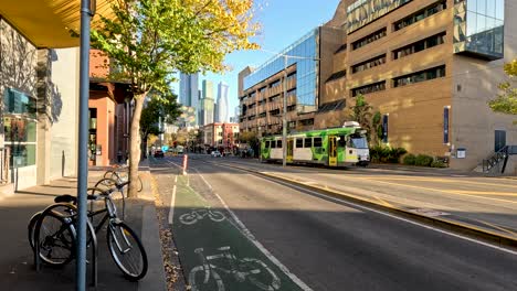 tram moving along a busy city street