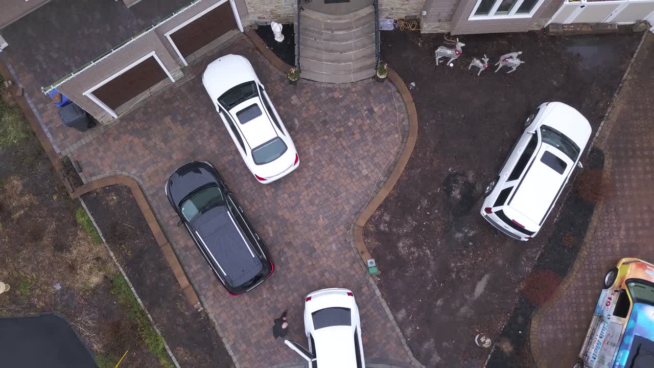 Bride leaving home in top-down aerial view