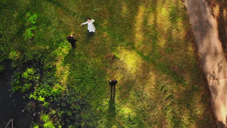 aerial view caucasian wedding couple on photoshoot outdoors in scenic lithuania nature