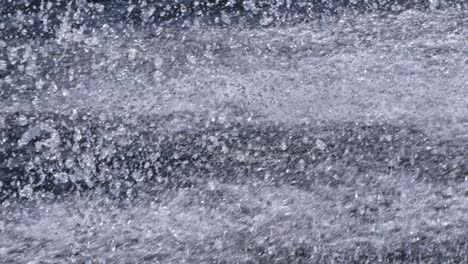 a close-up, slow-motion shot of water splashing, capturing the intricate details and dynamic movement of the droplets