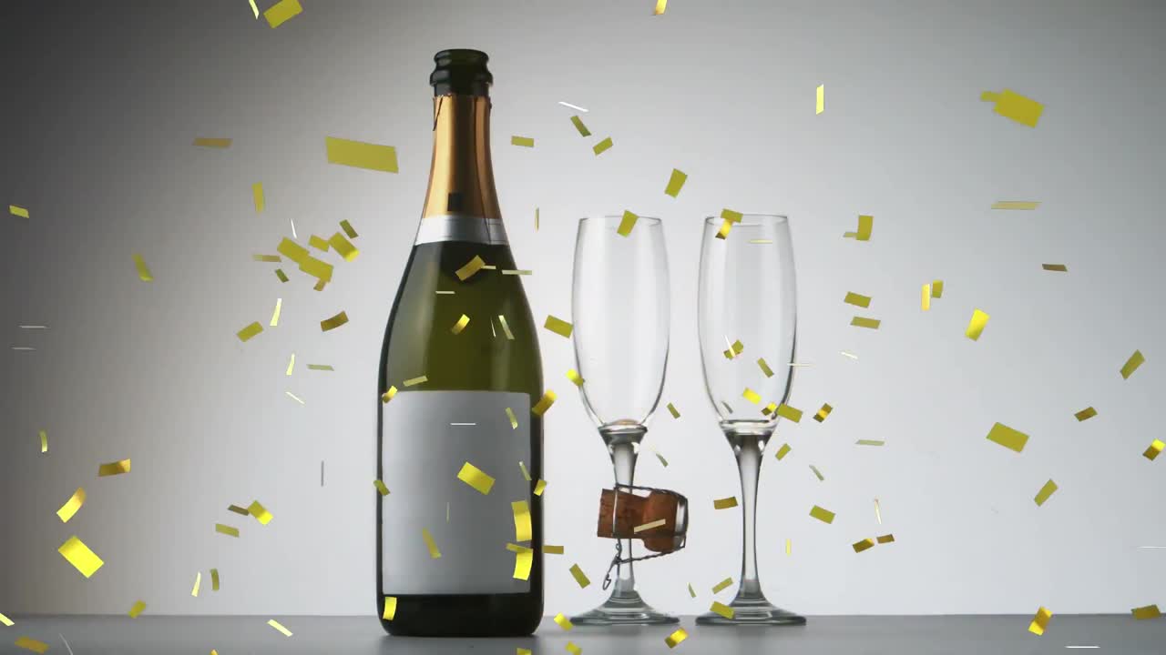 Animazione di coriandoli dorati che cadono su bicchieri di champagne