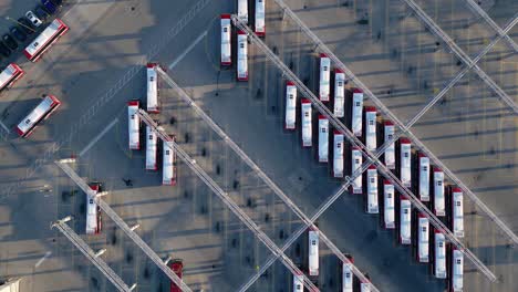 top down drone view of electric buses and charging stations at public transit centre