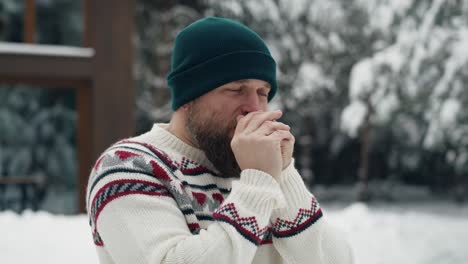 Caucasian-man-trying-warming-up-and-standing-outdoors.