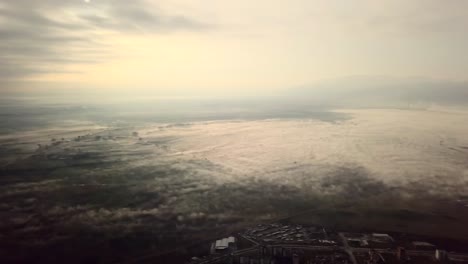 Flying-over-a-concrete-living-apartment-area-in-east-Europa-with-many-birds-flying-around-the-drone