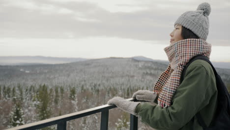 woman enjoying a winter mountain view