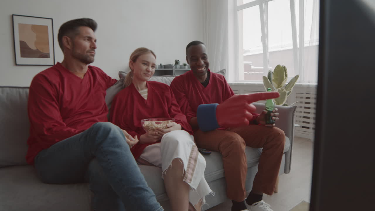 Woman and Men Watching Game