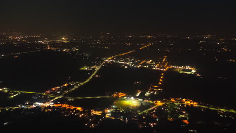 Timelapse-of-city-shot-from-above-at-night-with-moving-lights-of-cars